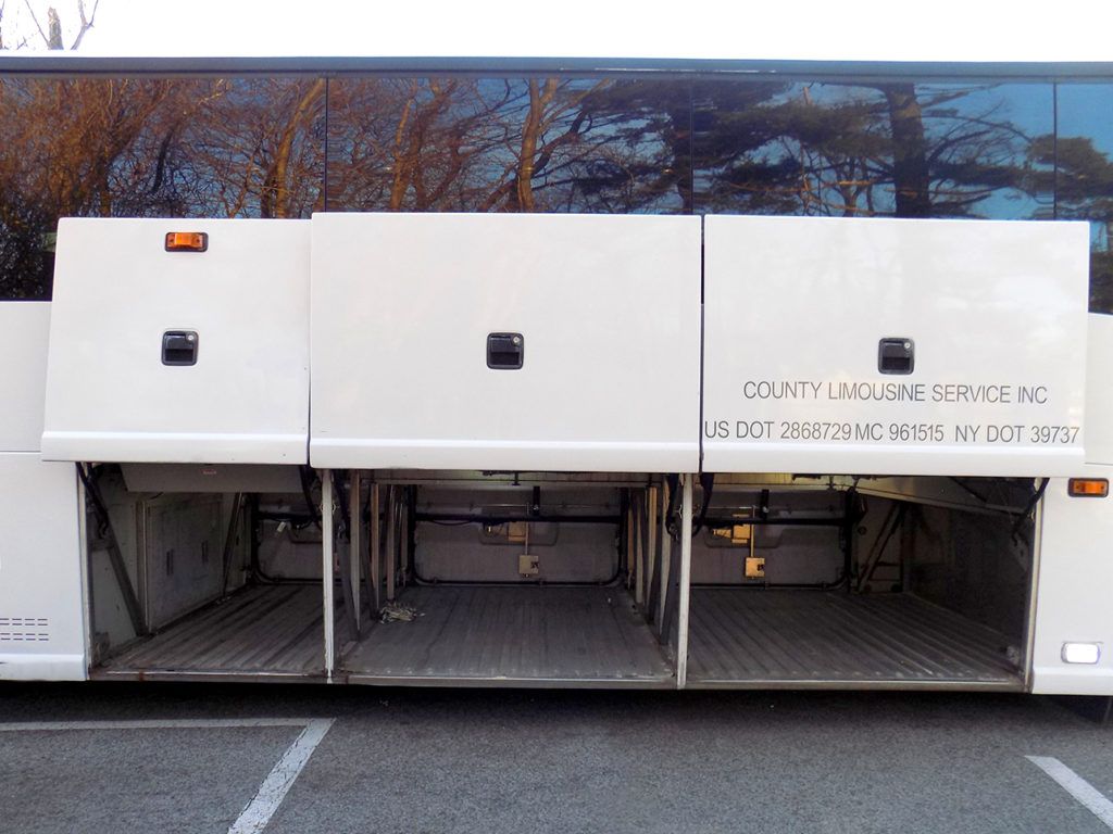 56 passenger charter bus luggage compartments with doors open