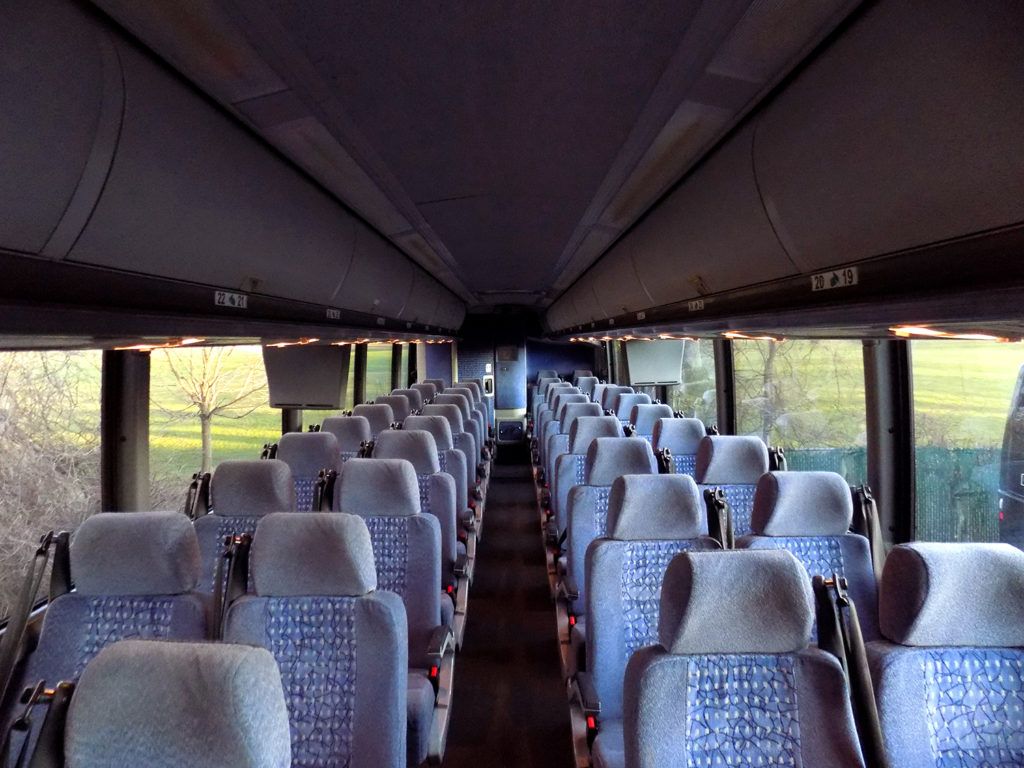 56 passenger charter bus cabin aisle and patterned coach seating