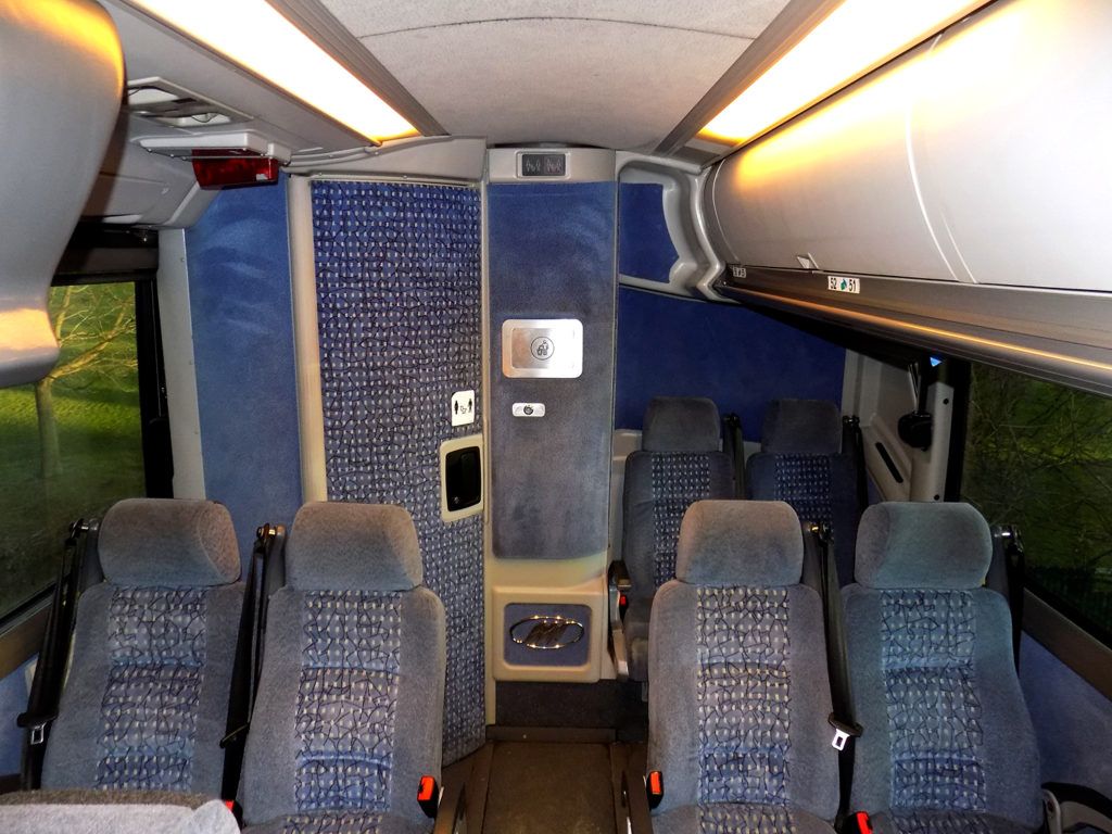 56 passenger charter bus mid-cabin seating and parcel racks