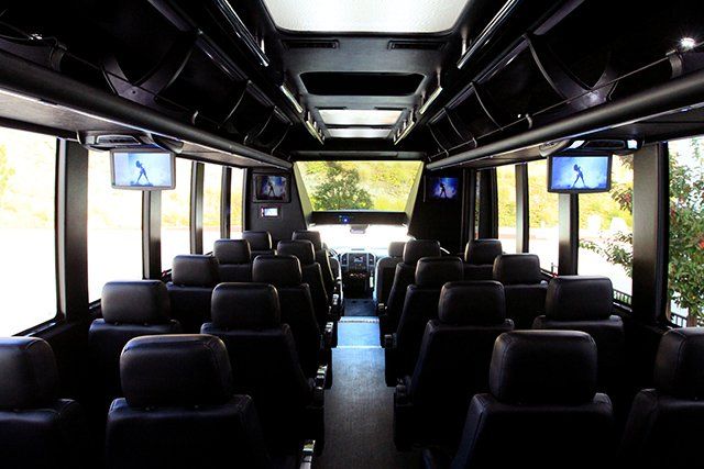 Ford F550 shuttle bus cabin with overhead screens