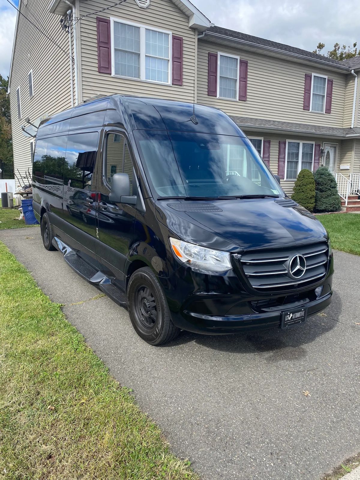 Mercedes Sprinter exterior parked, black executive van