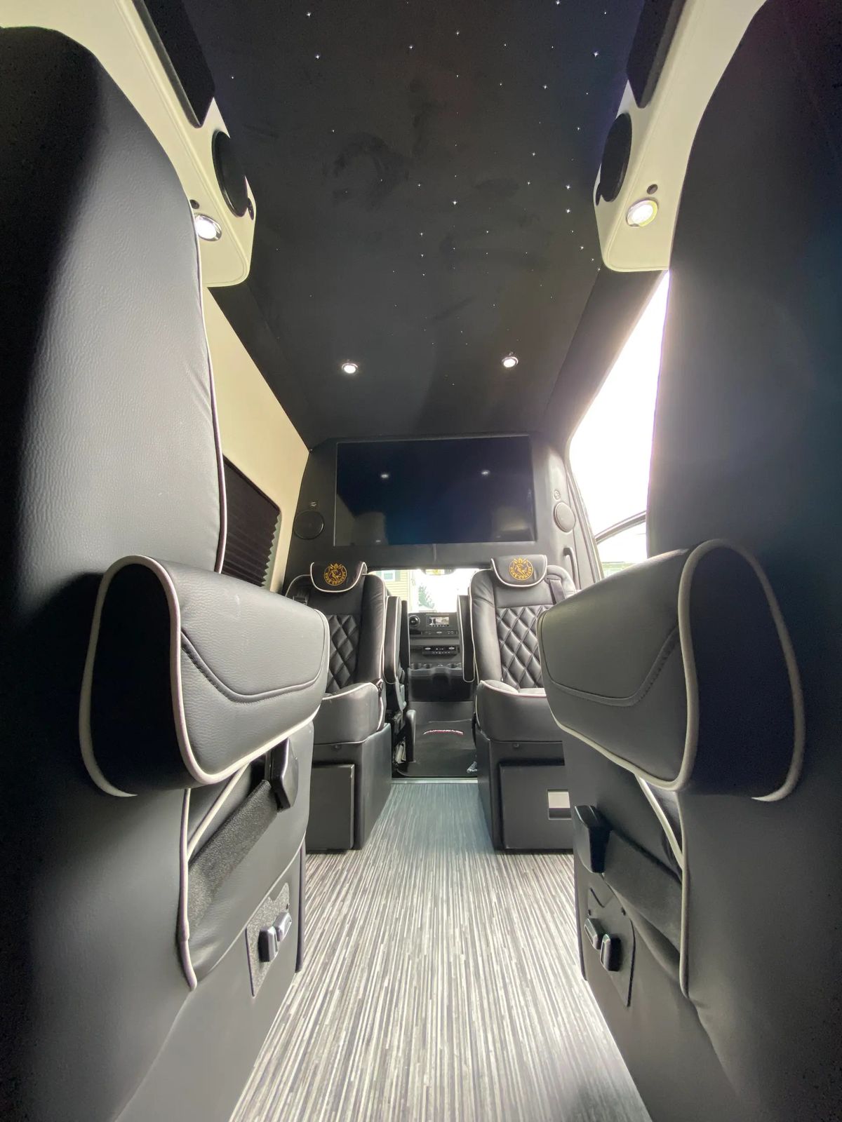 Mercedes Sprinter interior with starlight ceiling and leather seating