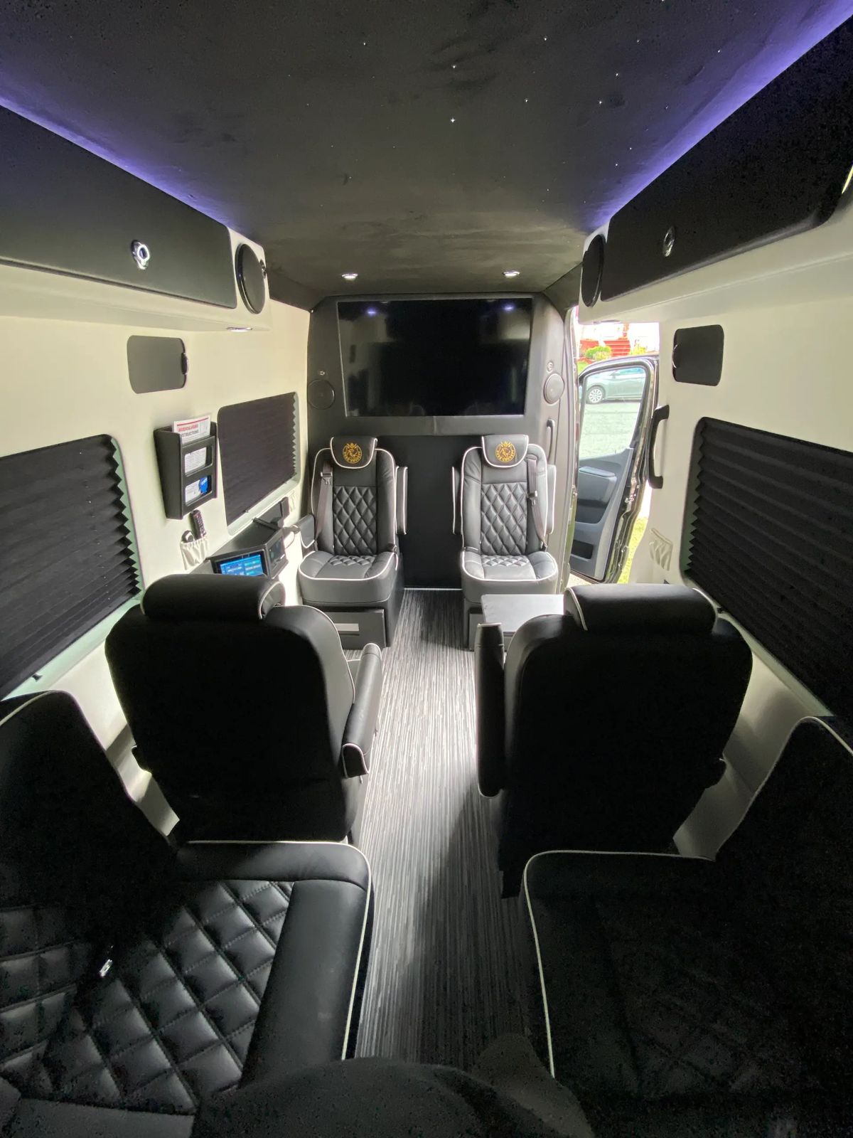 Mercedes Sprinter cabin with quilted leather seats and accent lighting